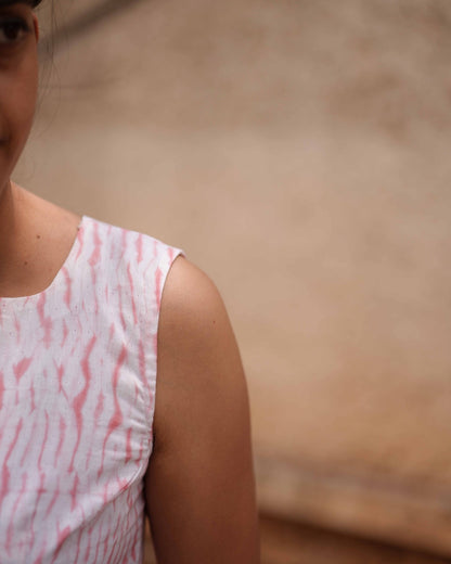 Left shoulder vertical close-up of the Vil Top, highlighting the delicate craftsmanship and flowy, breathable fabric.